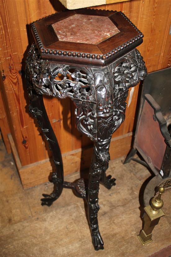 Late 19th century Chinese carved hardwood hexagonal vase stand(-)